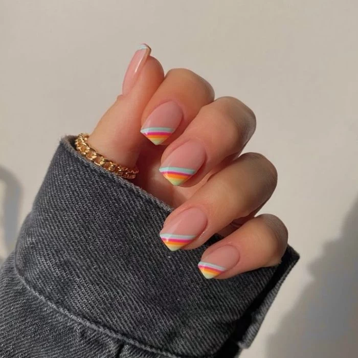 blue orange purple yellow rainbows on the corners of each nail spring nail designs medium length nails