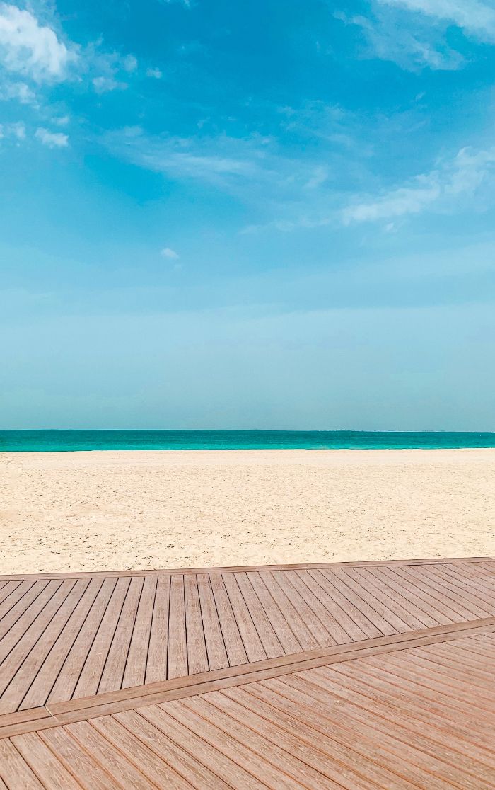 blue sky clear turquoise water wooden pathway beach desktop backgrounds pov photo