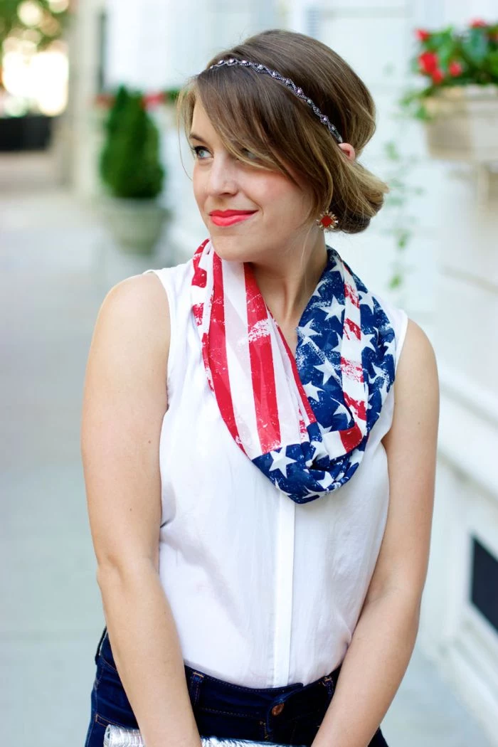 brunette woman wearing jeans white top 4th of july shirts american flag scarf