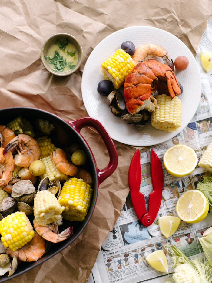 corn on the cob shrimp potatoes seafood boil recipe lemon wedges on the side