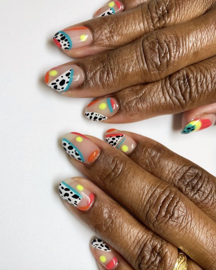 cow print abstract lines and circles in blue red orange yellow short nail designs medium length almond nails