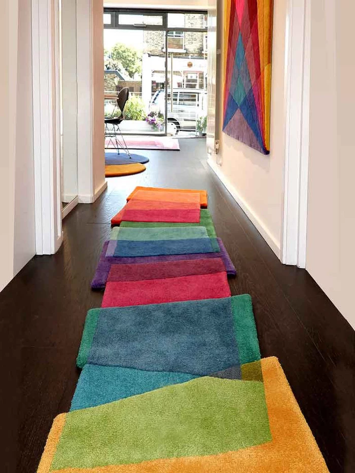entryway design ideas super colorful rug patches stitched together in different colors dark wooden floor