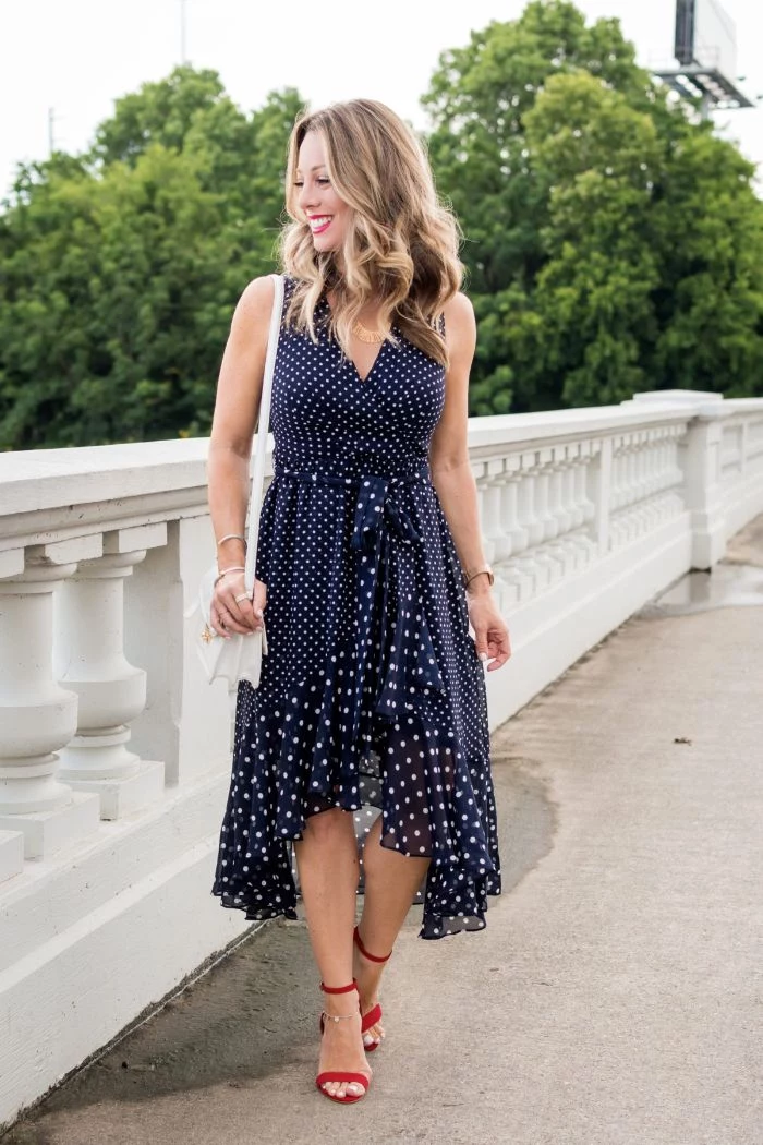 fourth of july outfits blonde woman wearing blue dress with white polka dots red sandals with heels