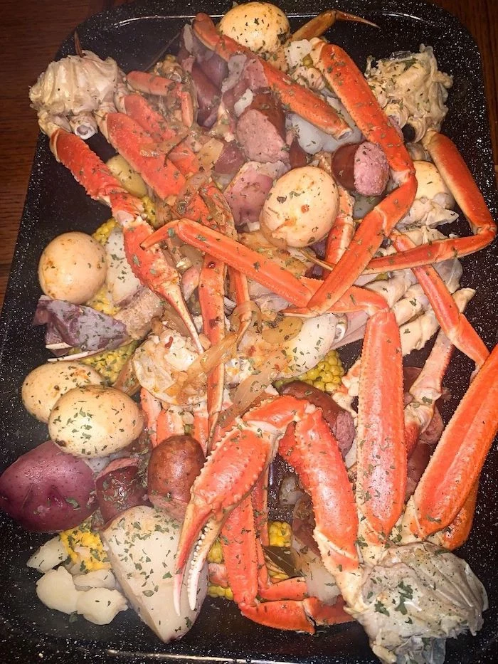 garlic butter seafood boil how to make a seafood boil with potatoes sausages onion placed in baking sheet
