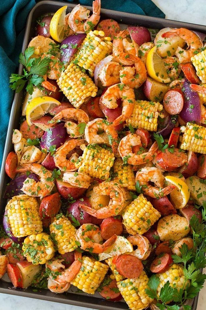 large baking sheet cajun seafood boil recipe filled with shrimp boil with potatoes sausages corn on the cob