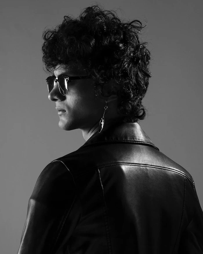 man wearing black leather jacket sunglasses homemade hair mask black curly hair