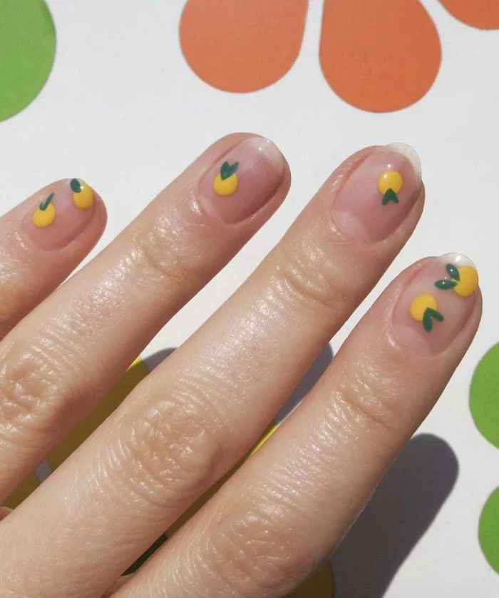 mini lemons decorations on nails with no nail polish cute nail designs minimalistic design
