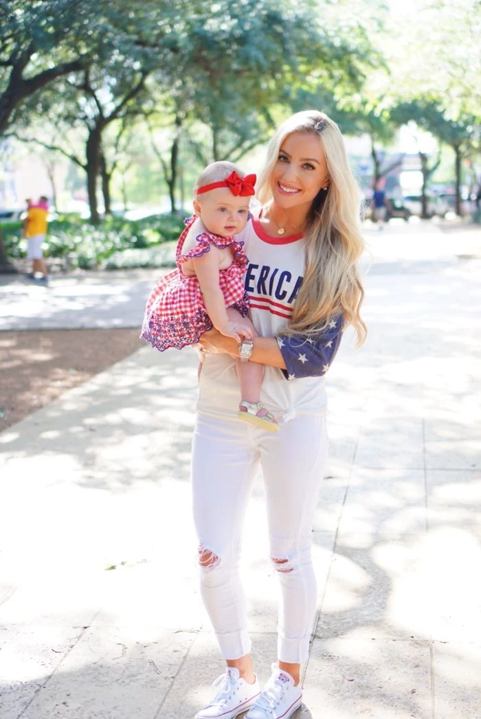mom wearing america blouse white jeans baby wearing red and white dress 4th of july dress