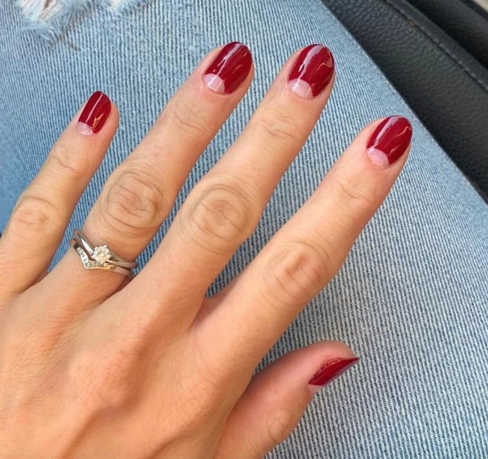 nail design ideas negative space half moons rest of nail covered with red nail polish short nails