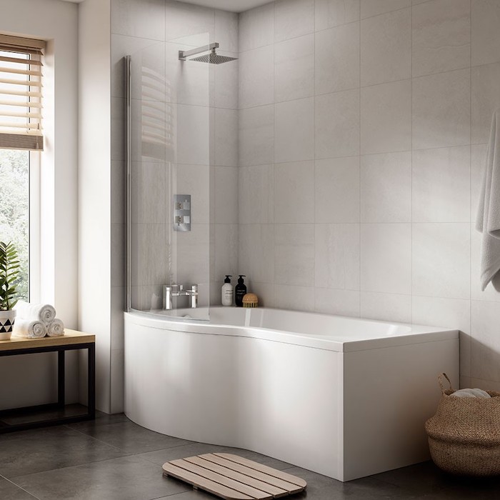 p shaped bath in bathroom with white tiles on the walls dark tiles on the floor shower bath ideas