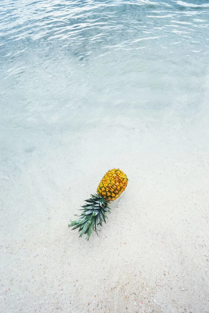 pineapple placed on beach with white sand beach desktop backgrounds water coming in
