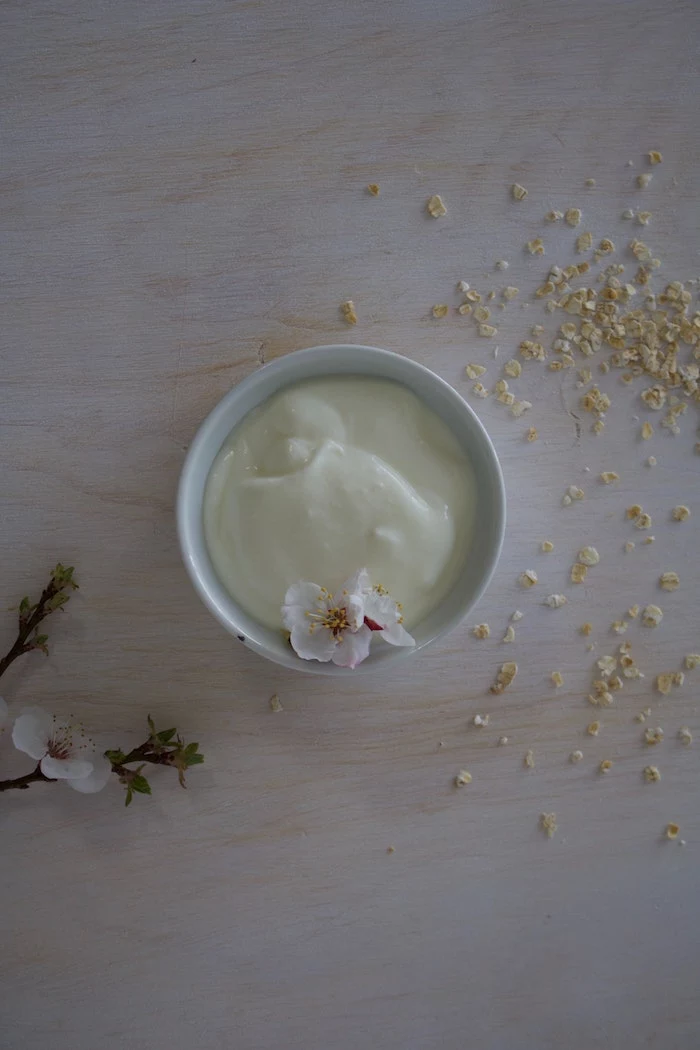 plain yogurt in white ceramic bowl best hair mask for dry hair small flower on the side