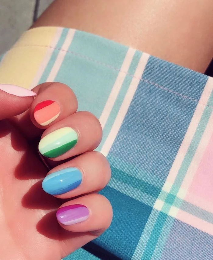 rainbow nails in red orange yellow green blue purple and pink cute short acrylic nails medium length nails