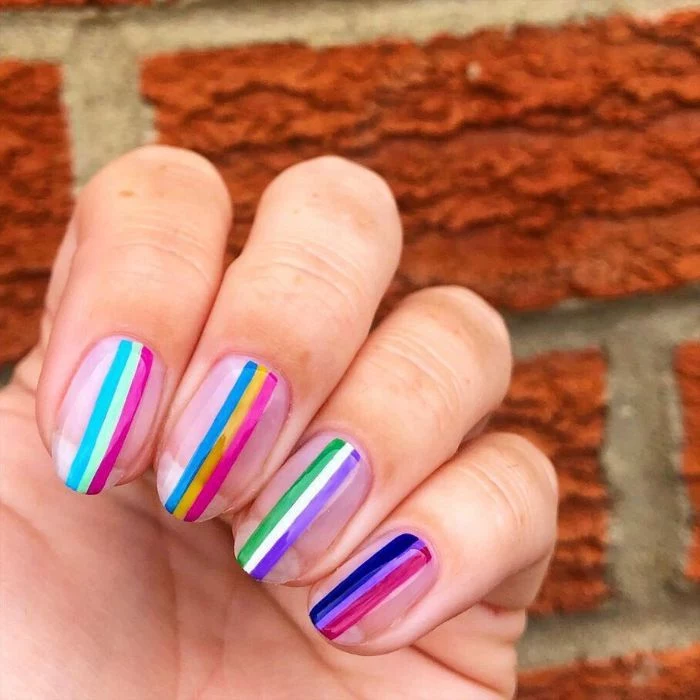 rainbow stripes on medium length nails short nail designs blue purple yellow green pink
