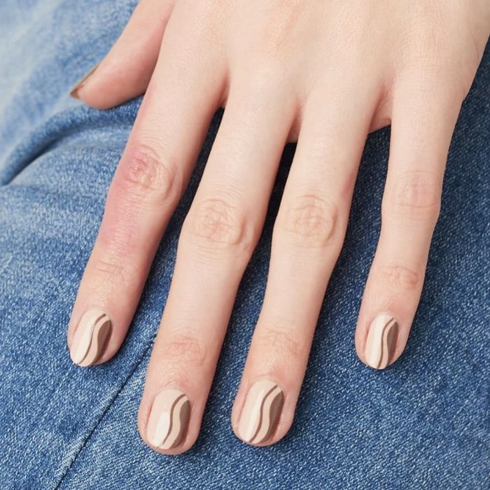 white and brown swirls on nude nail polish nail design ideas short squoval nails