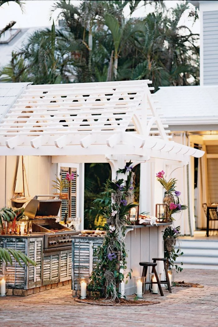 bar decorated with exotic flowers backyard design ideas barbecue under white wooden pergola