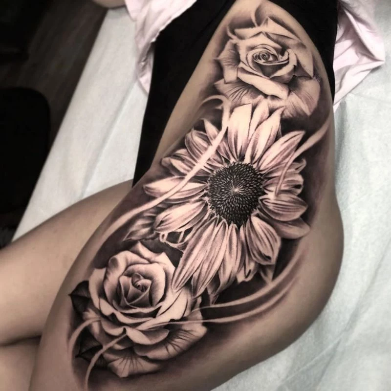 black and white sunflower tattoo side thigh tattoo