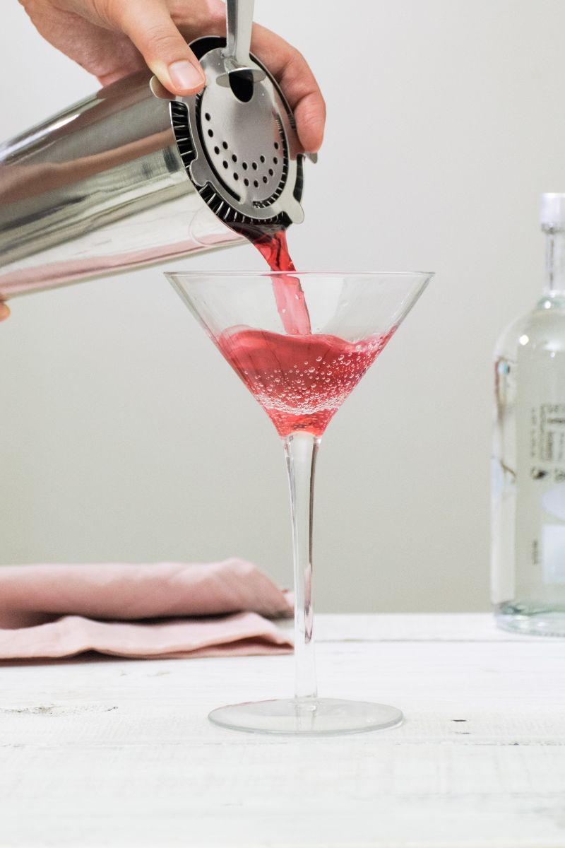 cosmopolitan poured in martini glass vodka mixed drinks