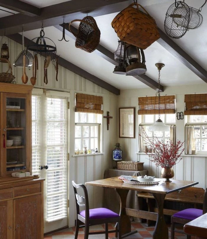 different baskets lanterns hanging from ceiling with exposed wood beams dining room table decor ideas purple chairs