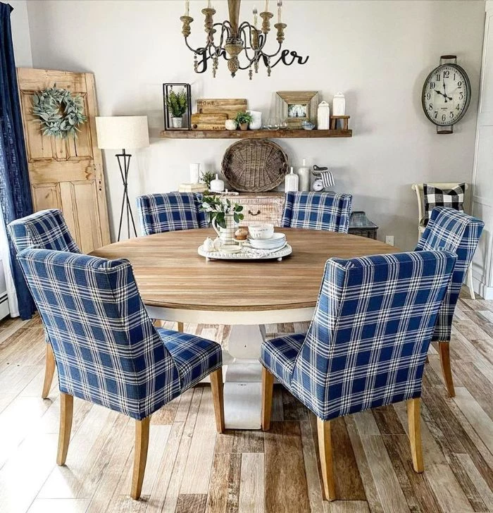 dining room table decor ideas blue chairs around round table open shelving on the wall