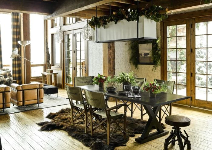 farmhouse dining room decor faux fur rug black wooden table with vintage chairs around it