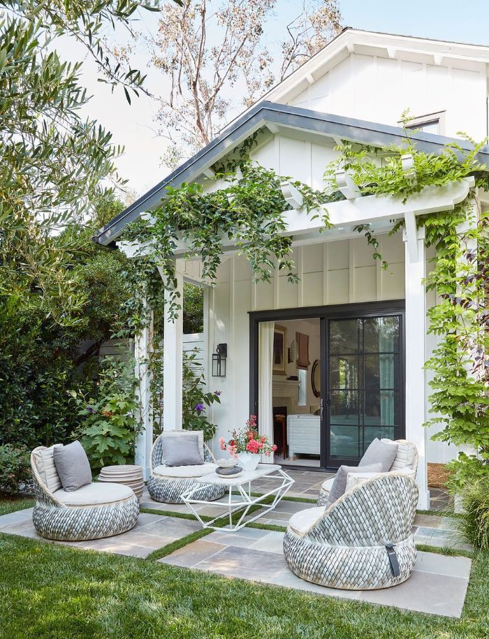 garden furniture four lounge chairs table placed in front of back door small backyard landscaping ideas