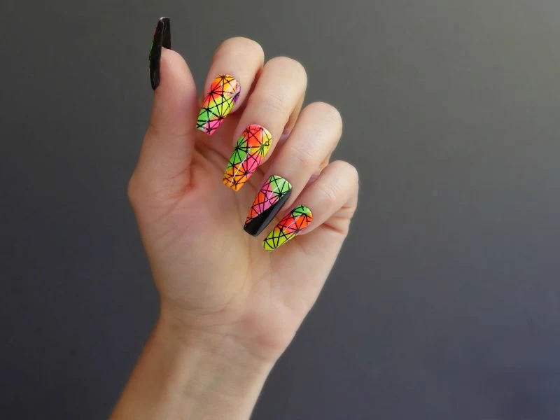 geometric design neon yellow nails with black