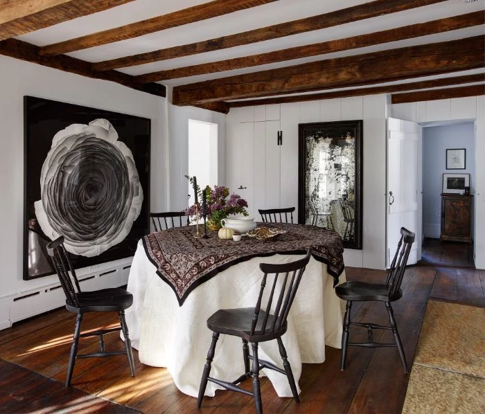 white walls with black art on them dining room design ideas table covered with table cloth black chairs