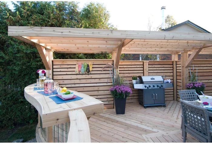 wooden pergola small backyard landscaping ideas barbecue and bar underneath dining area
