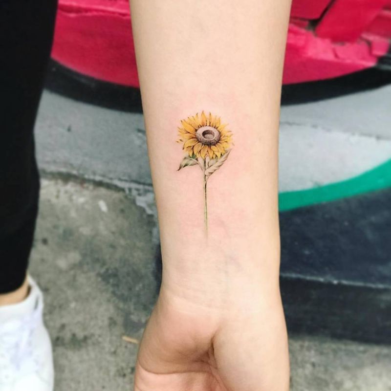 wrist tattoo sunflower tattoo meaning colored