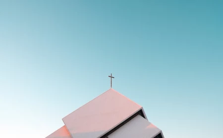 blue sky with church building with cross
