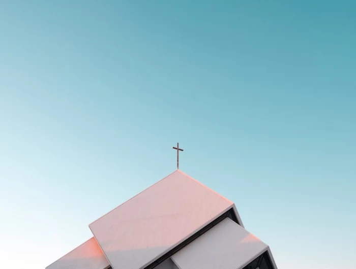 blue sky with church building with cross