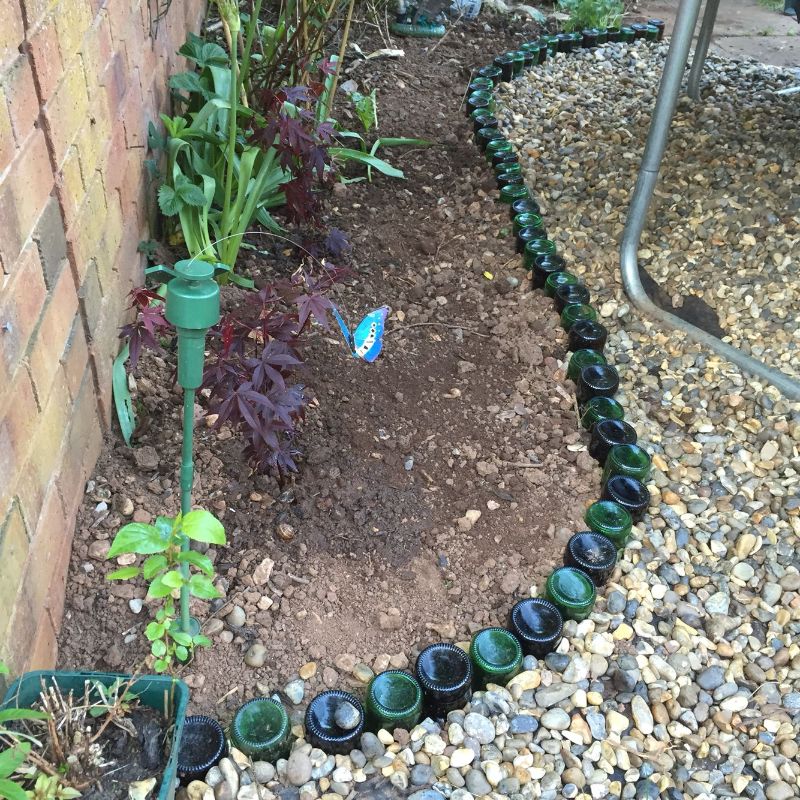 garden edging glass bottles into the ground