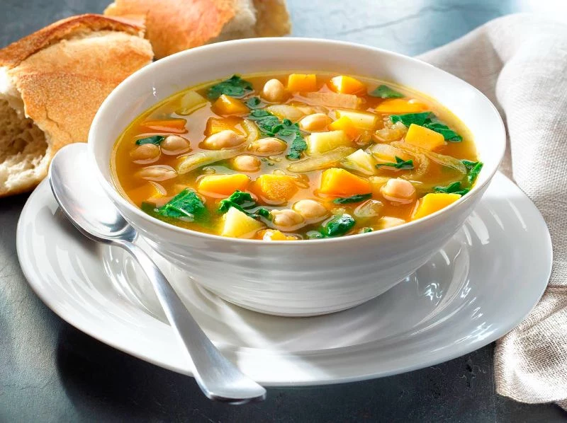 chickpea vegetable soup in white bowl