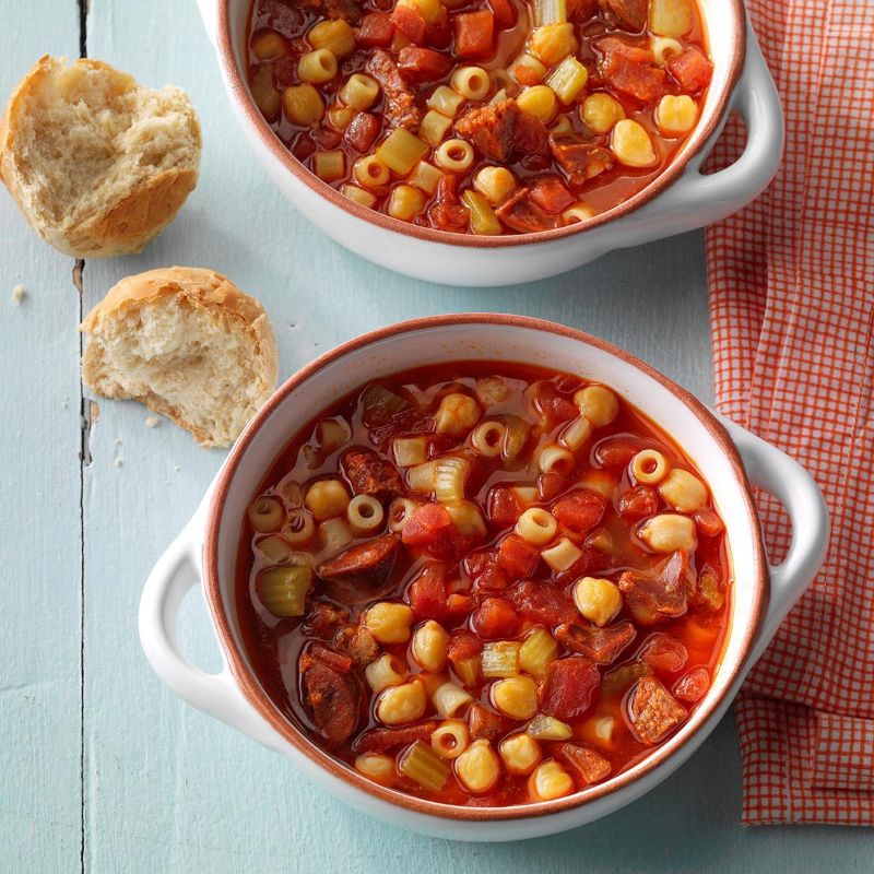 chorizo and chickpea soup recipe in two white bowls