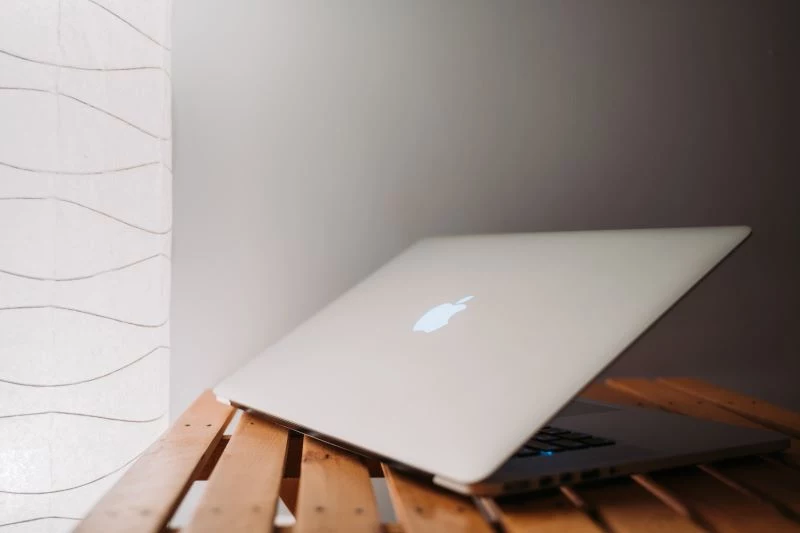 half closed laptop redesigning your home wooden table