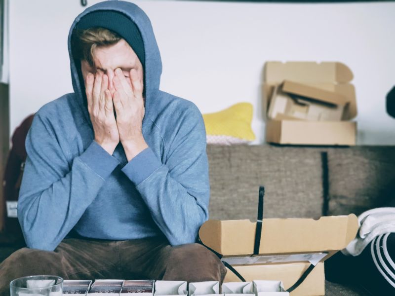 liver detox man tired sitting on sofa