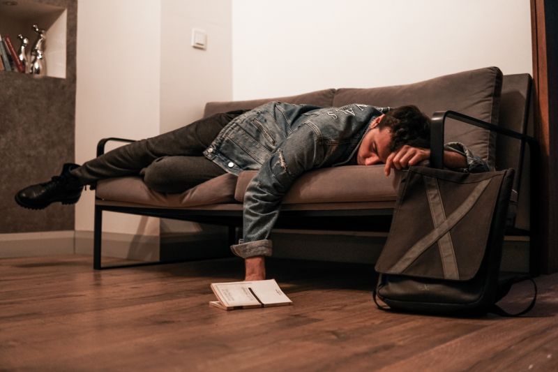 liver healing foods man laying on sofa