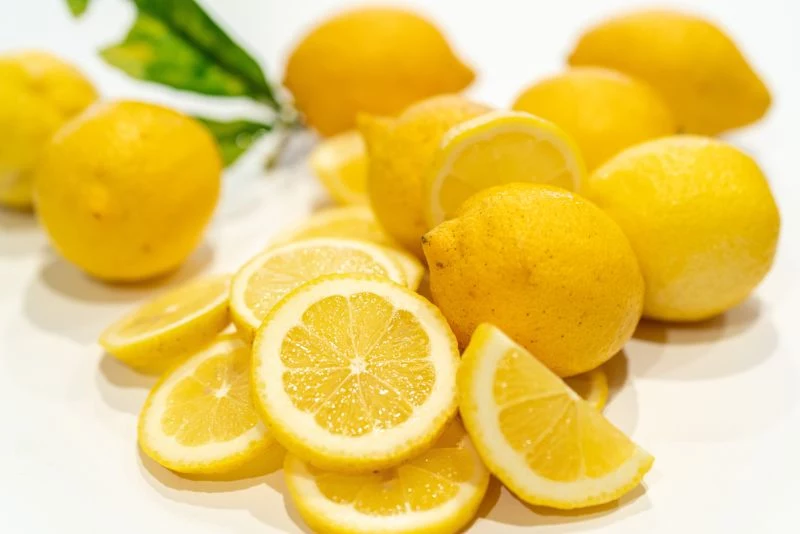 lots of sliced lemons benefits of lemon water