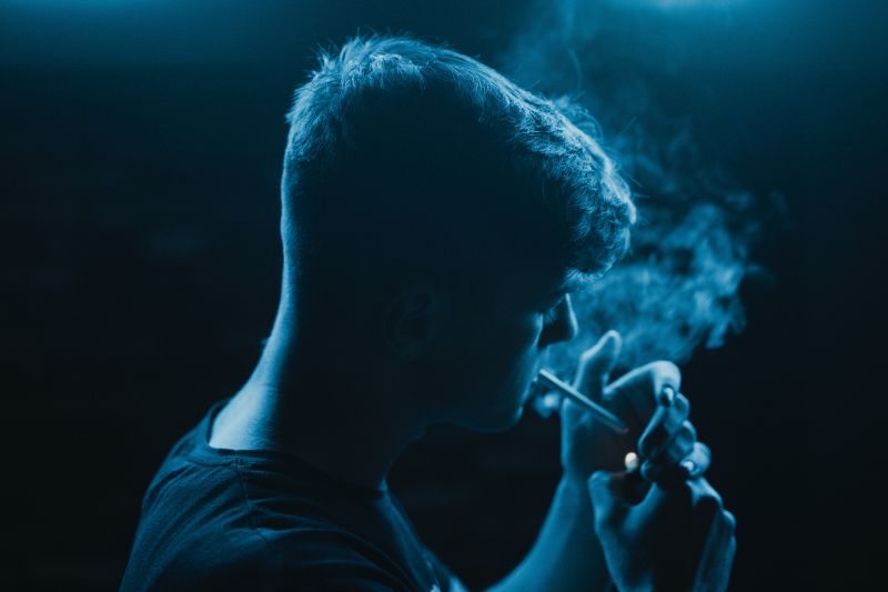 man smoking foods for liver health cigarette