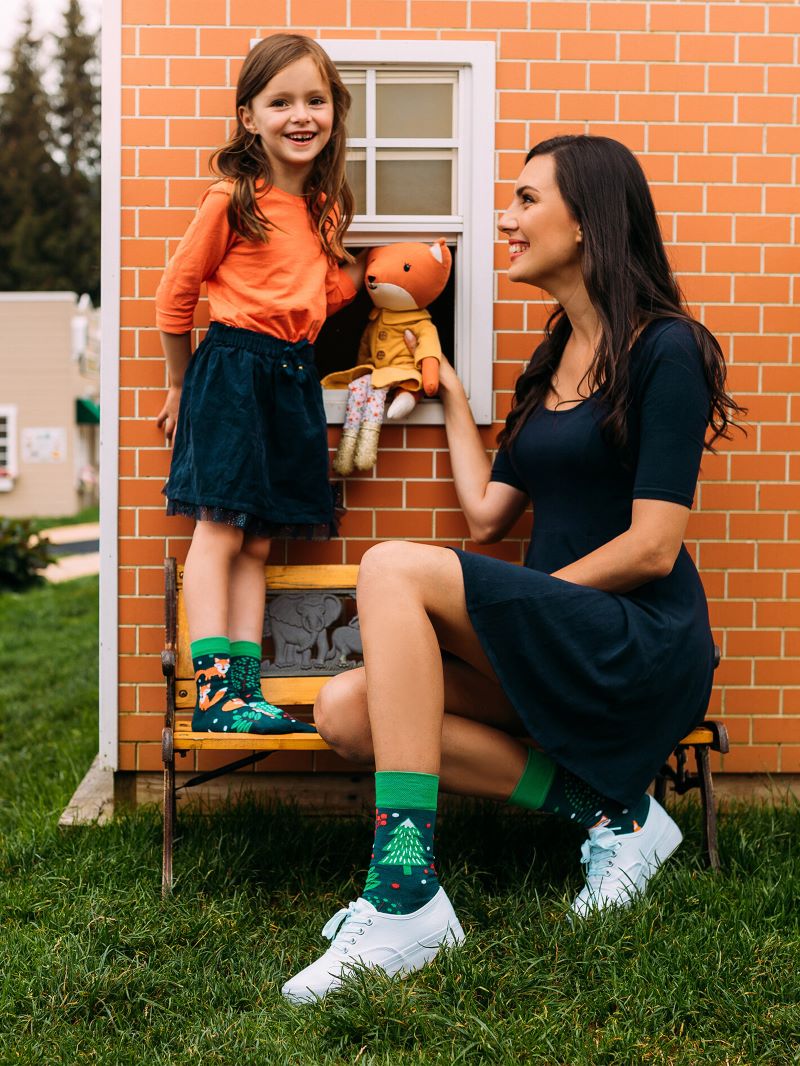 mom daughter high socks with prints sitting on bench