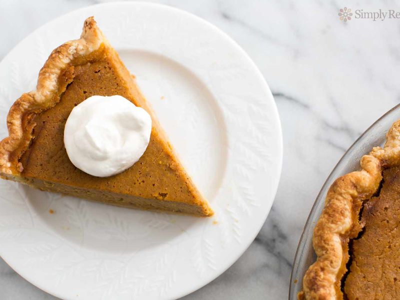 pumpkin recipes pumpkin pie slice on white plate