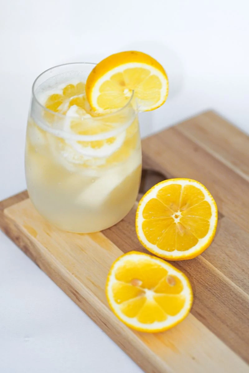 water in glass is lemon water good for you with lemon slices