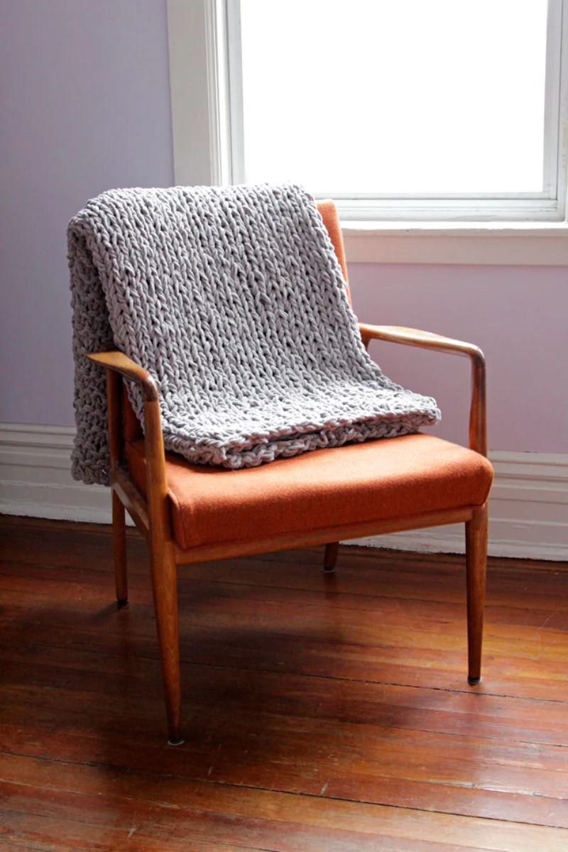 blanket thrown on chair learn to knit