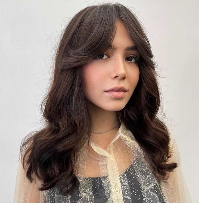 curtain bangs wavy brunette hair