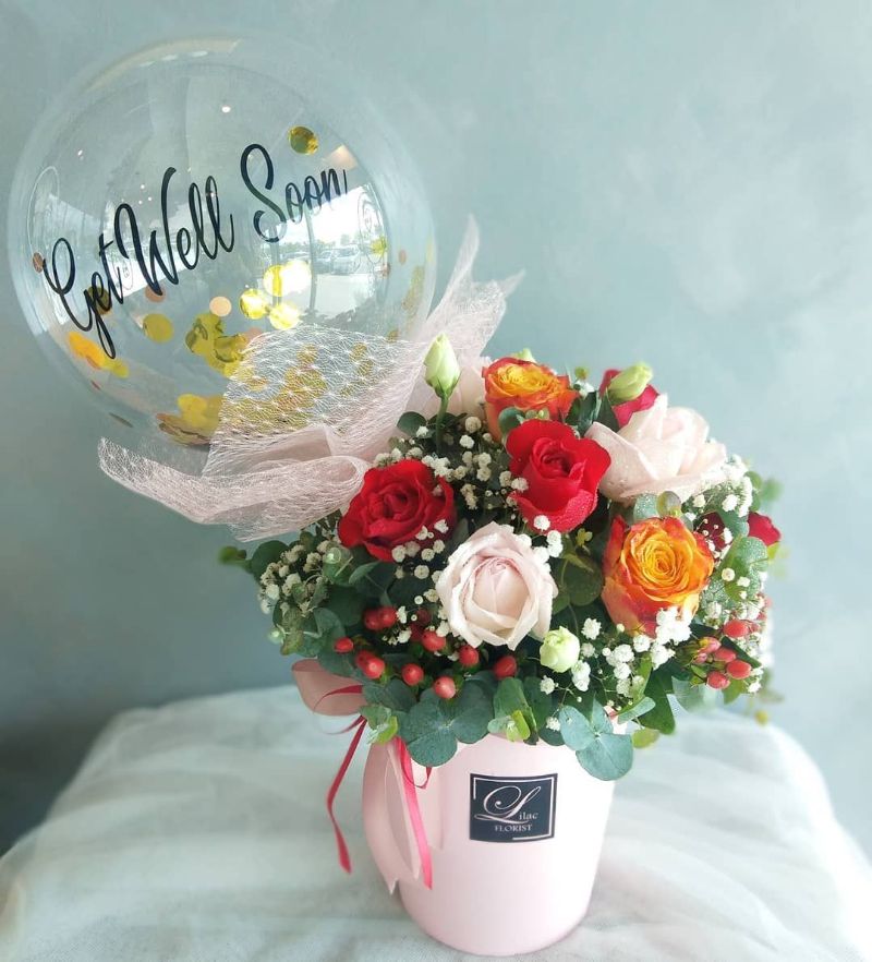 floral arrangement get well wishes with balloon