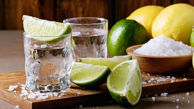 what to mix with tequila two glasses with lime wedges