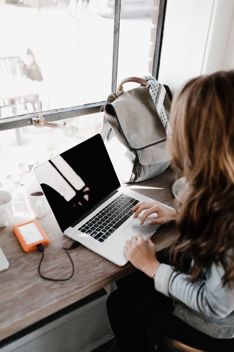 woman in front of laptop health and fitness advice