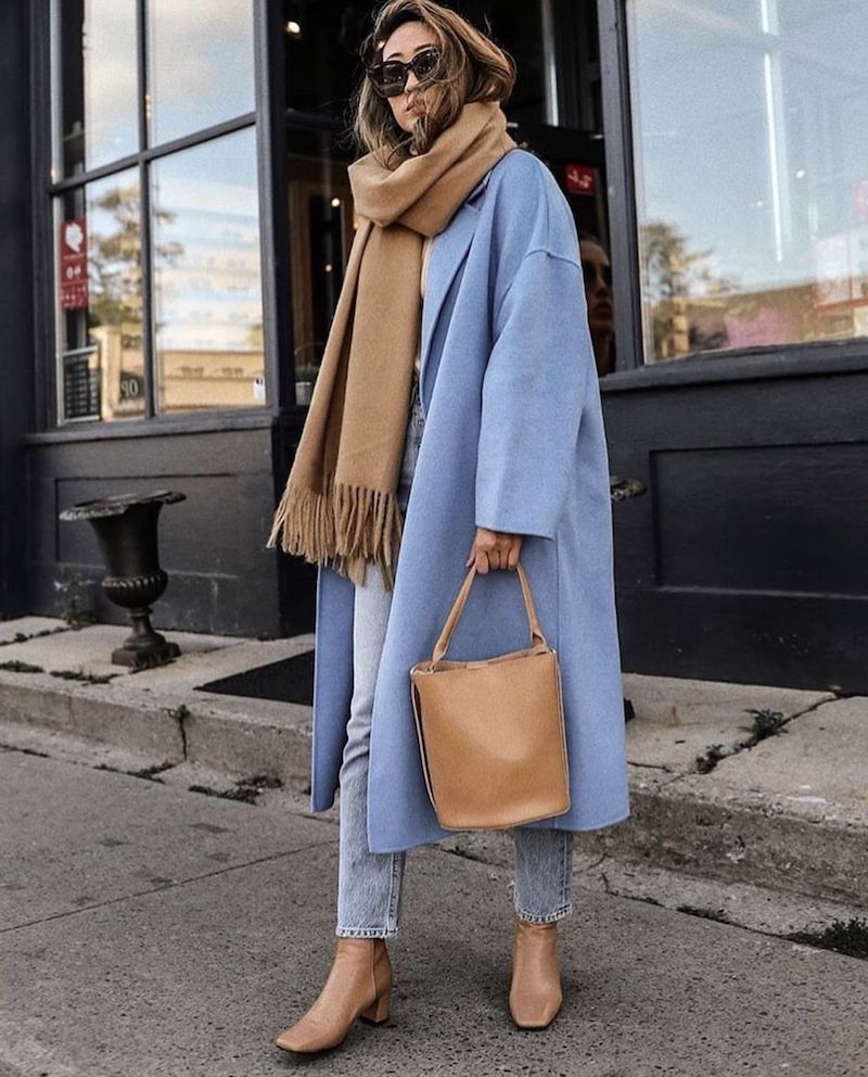 baby blue coat with beige scarf and bag