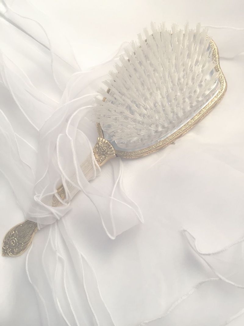 beautiful silver vintage hair brush with white ribbon